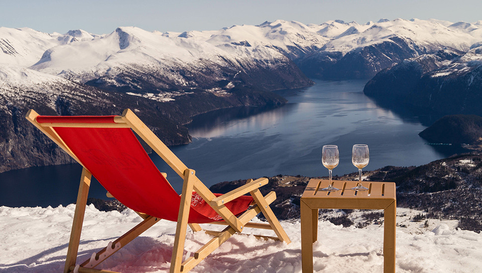 Red deck chair on Norwegian mountanin