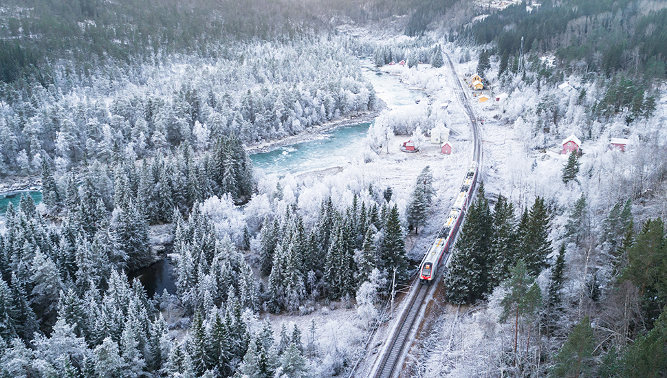 Train running through Oslo in the Bergen mountains