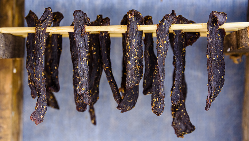South african meat biltong dries on a wooden sticks
