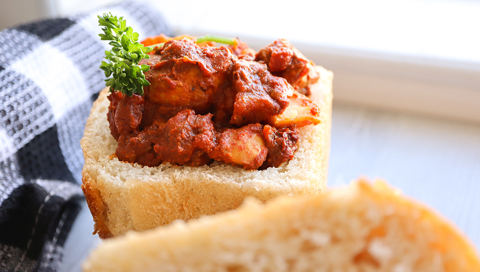 South African cuisine. Bunny chow. Loaf of bread filled with curry. Chicken curry