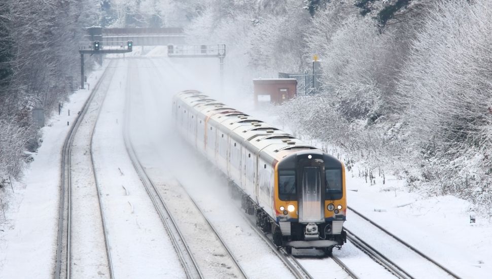 Commuter train travelling in snow