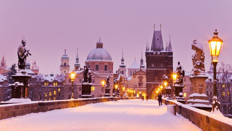 Snow covered St Charles Bridge in Prague