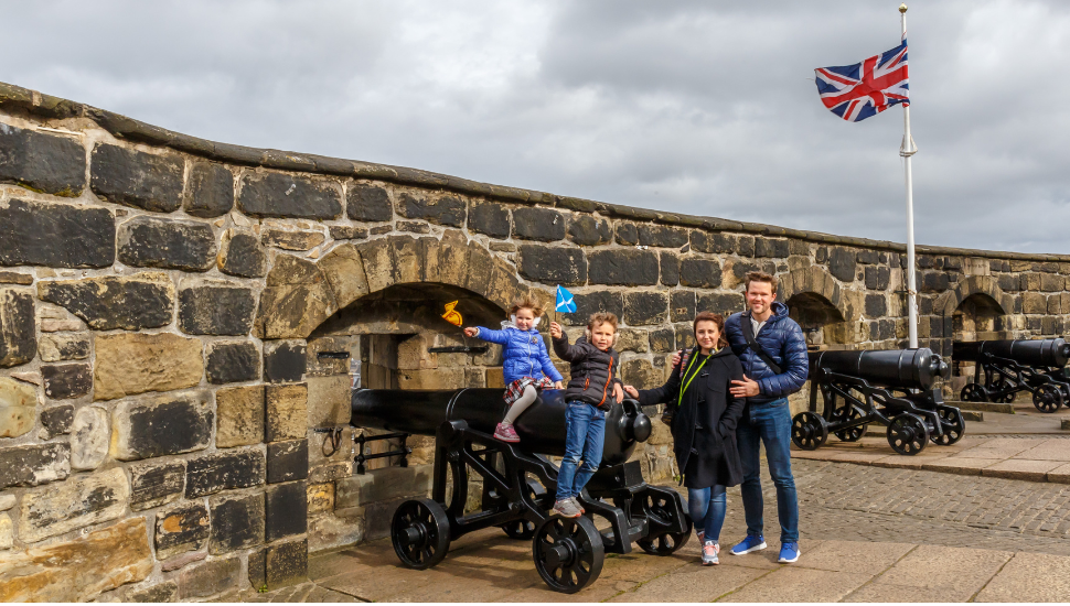 Family enjoying trip to Edinburgh Castle, Scotland