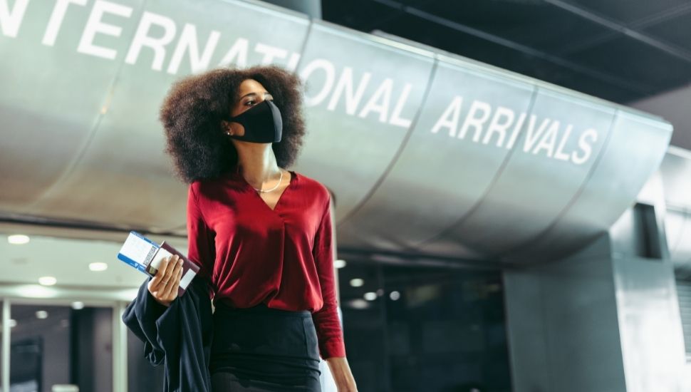 Woman at international arrivals at airport