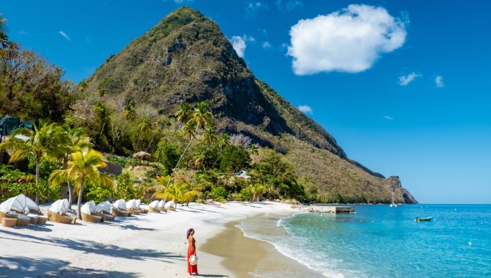 Woman walking on the beach in St Lucia