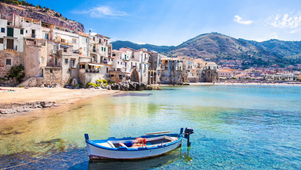 Old harbour with wooden fishing boat in Cefalu, Sicily
