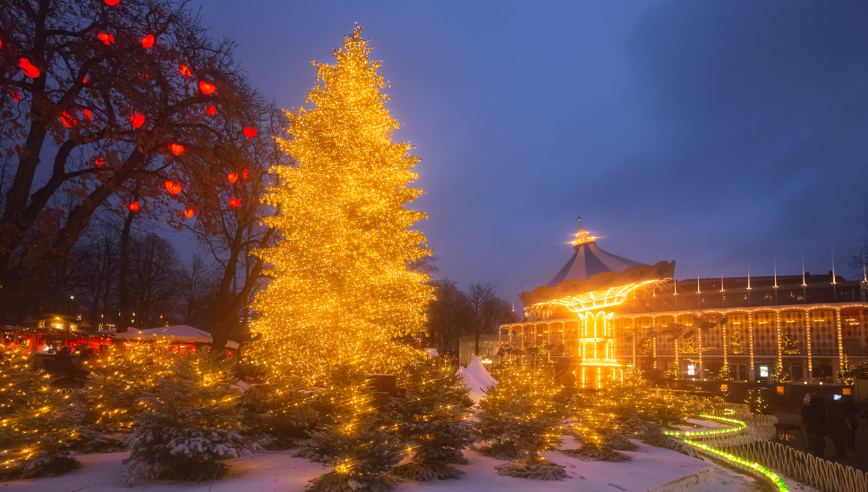 Christmas lights in a snowy Tivoli Gardens, Copenhagen, Denmark