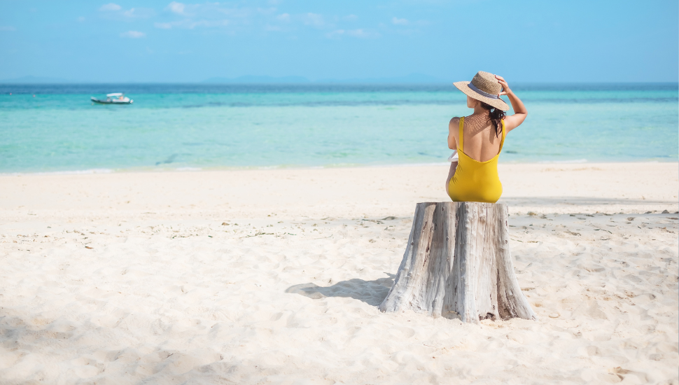 Solo traveller relaxing on beach