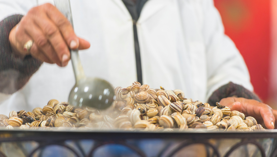 Boiled snails at a street market in Marrakesh, Morocco