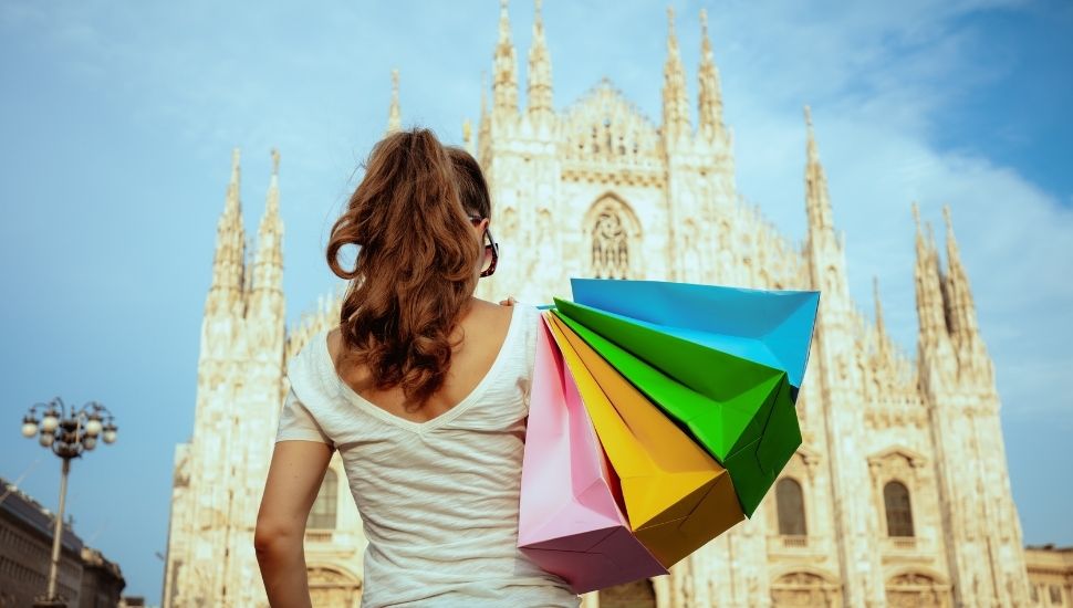 Tourist with shopping bags in Milan, Italy
