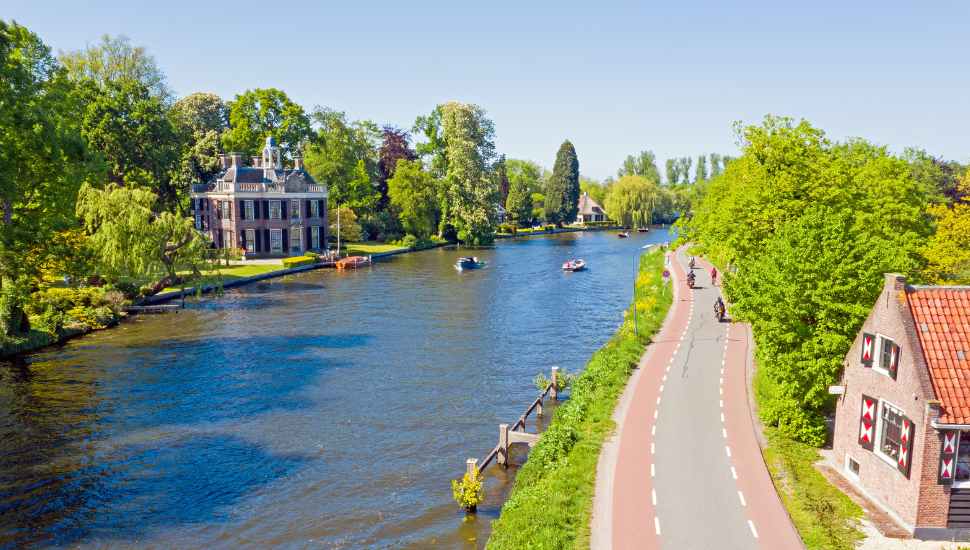 Cycle path next to the river Vecht in Holland
