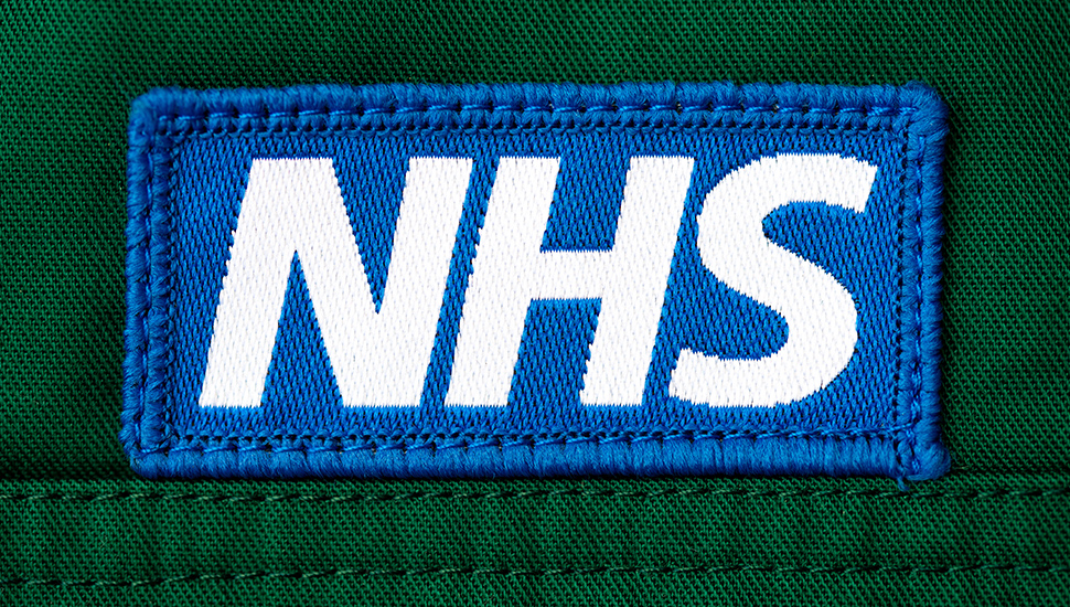 NHS badge on uniform