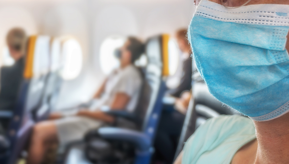 Airline passenger wearing mask