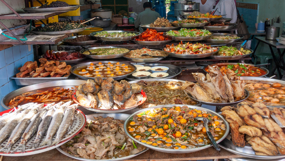 Platters of Thai food in a street kitchen