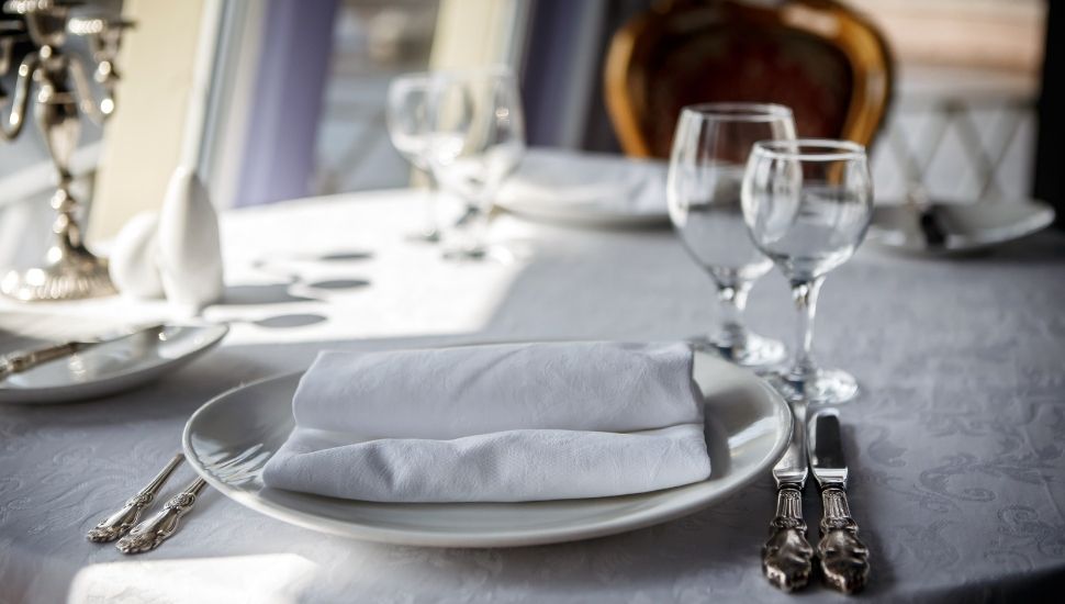 Table set for luxury dining aboard a cruise