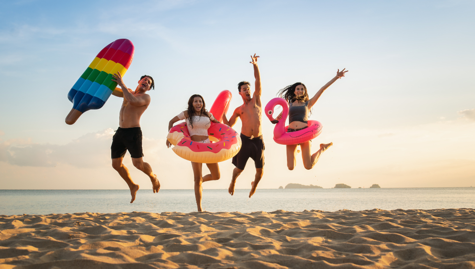 Friends having fun on beach on holiday