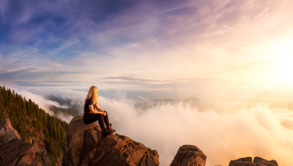 Female hiker atop St. Mark's, Vancouver, British Columbia, Canada.